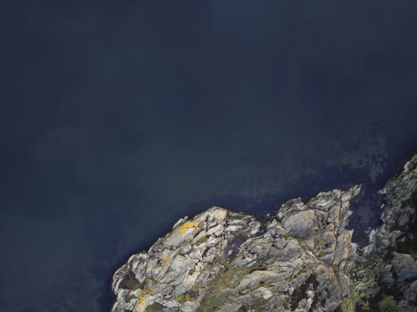 Image of rocks in an ocean.